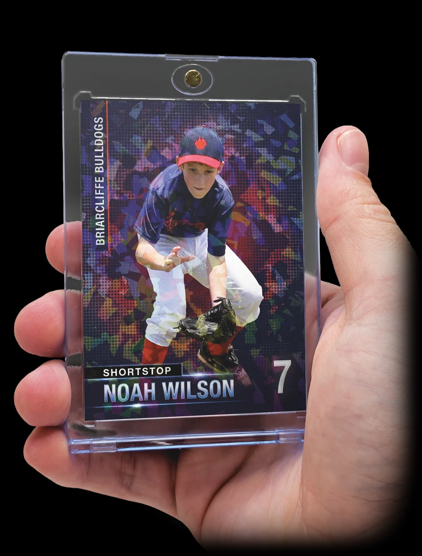 Custom sports card in a magnetic display case, held in hand